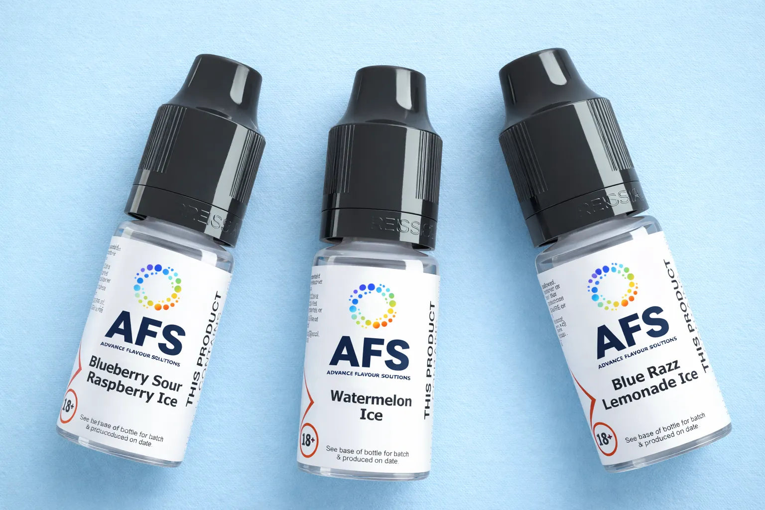 Three AFS branded vape juice bottles on a light blue background