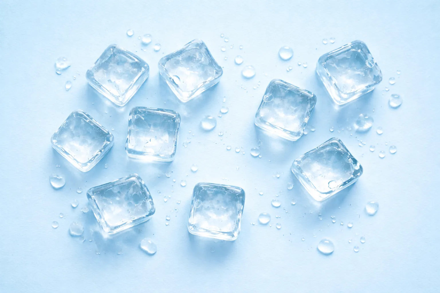 Ice cubes on a light blue background